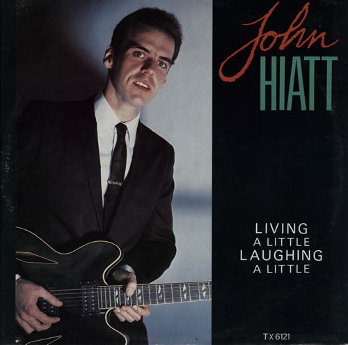 File:Living A Little, Laughing A Little 12" single front sleeve.jpg